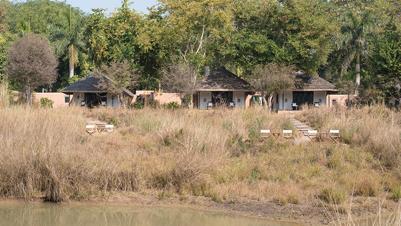 Thatched cottages at Khem Villas