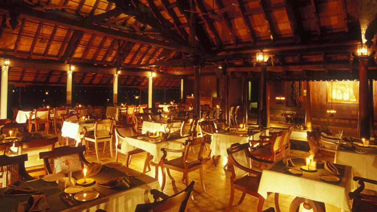 Restaurant at night at Kumarakom Lake Resort