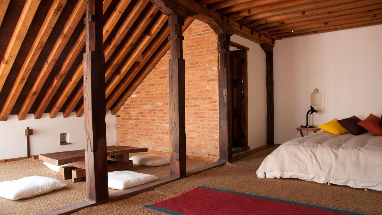 Bedroom with wooden features at Inn Patan