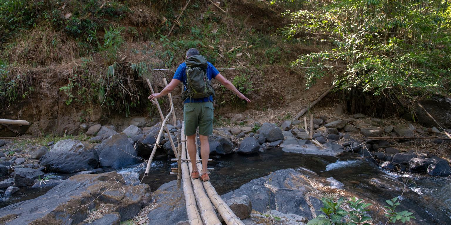 crossing a river in the maliau basin