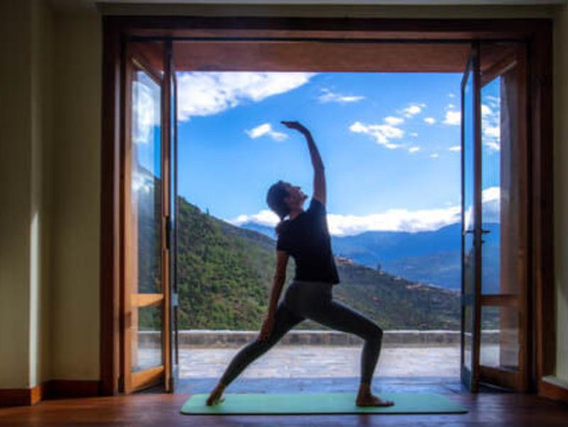 Women doing yoga pose at Bhutan Spirit Sanctuary