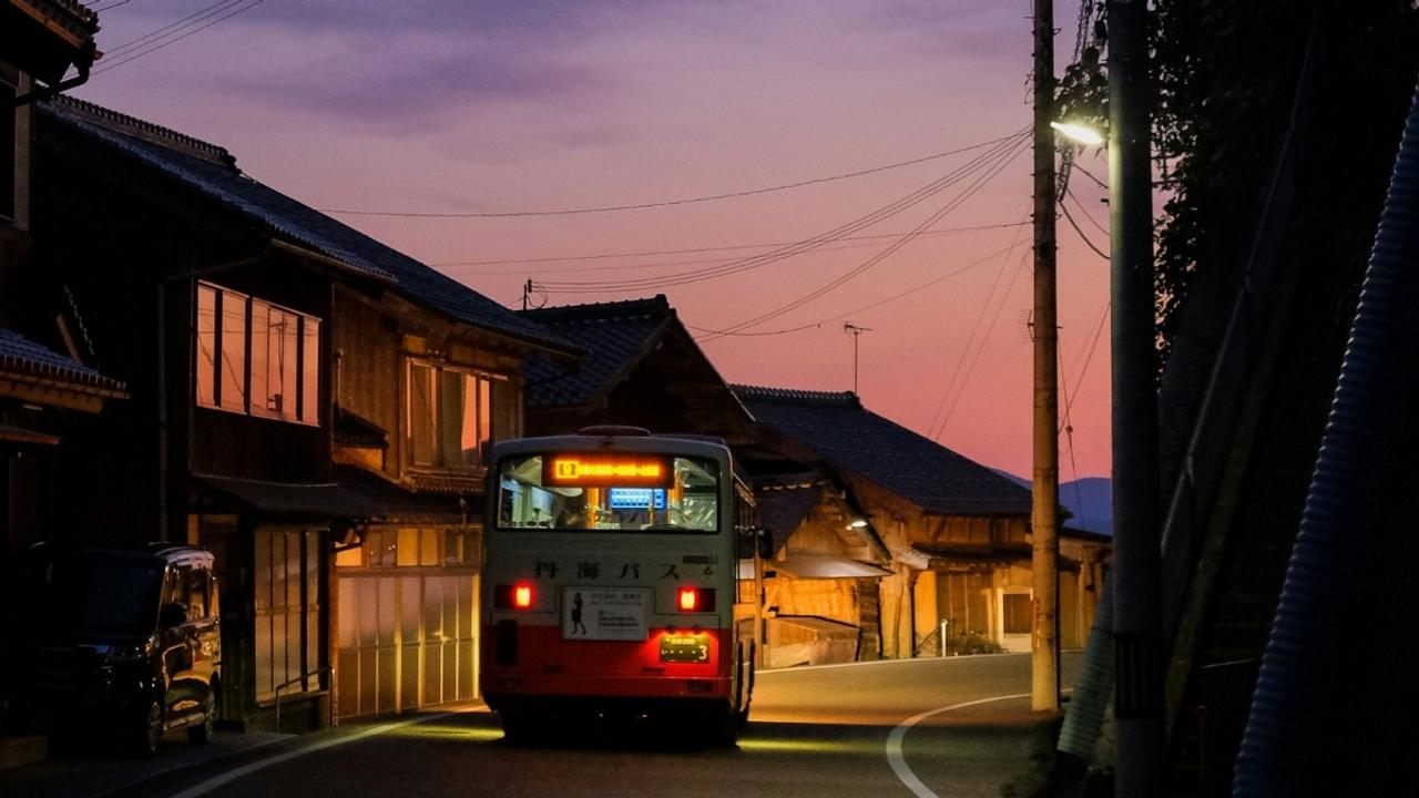 Bus going through Ine at sunset Japan