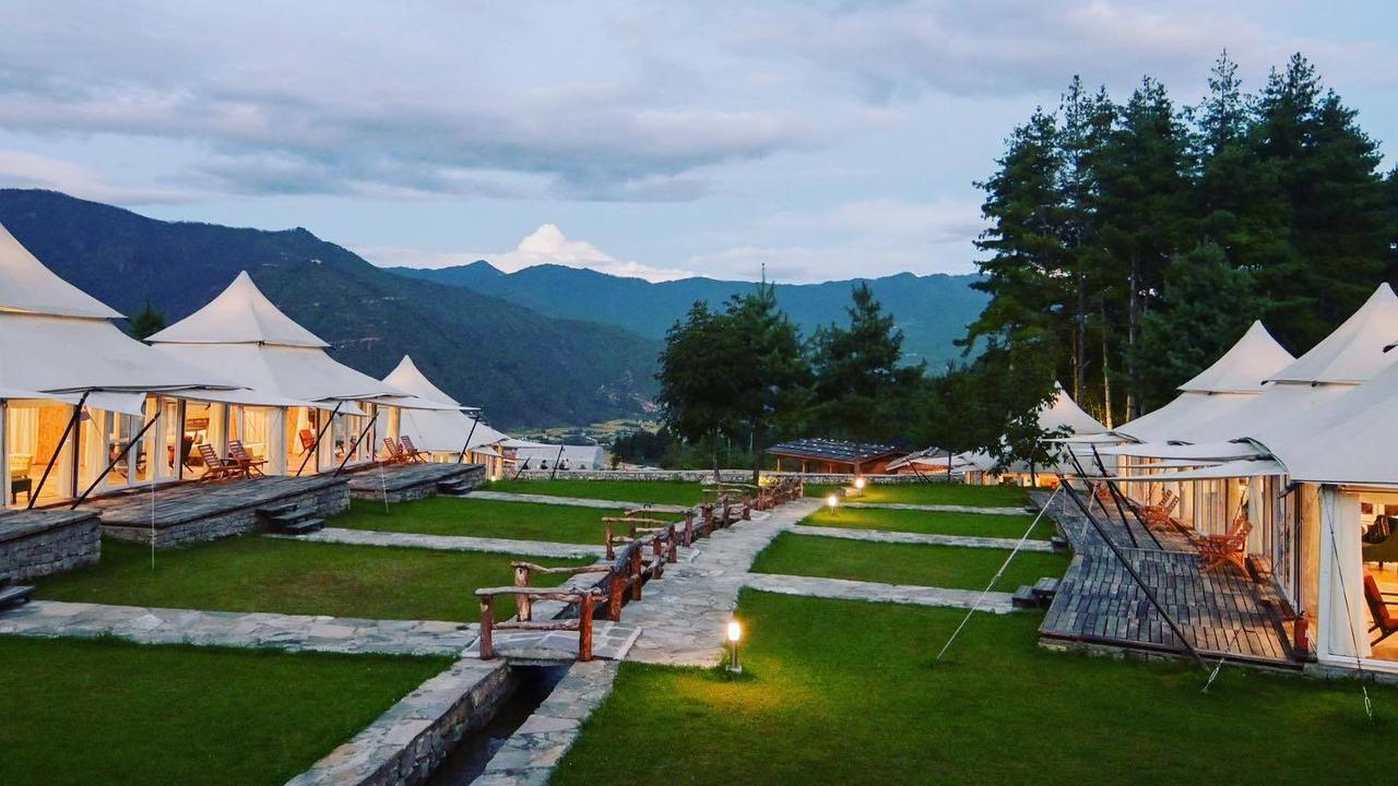 Rows of pavilion tents at twilight